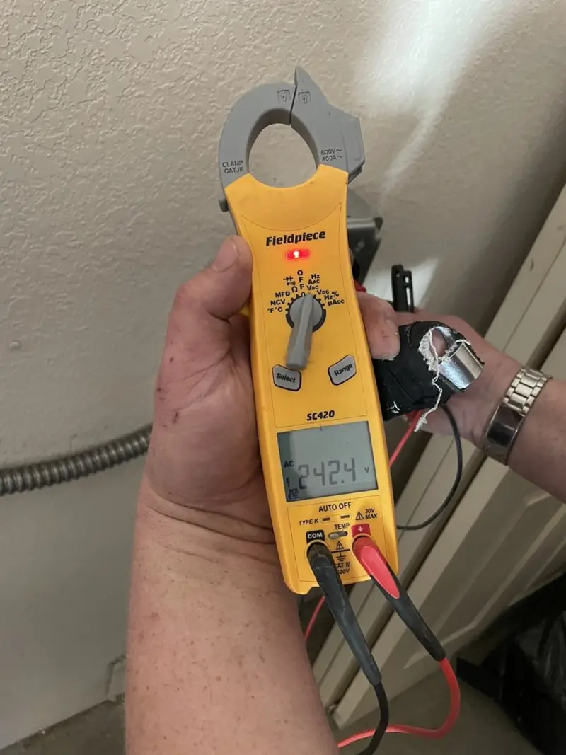 Voltage testing with clamp meter during Ceiling Fan Installation in Sioux Falls